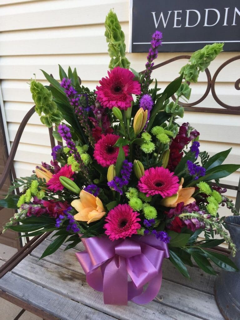 A bouquet of flowers sitting on top of a table.