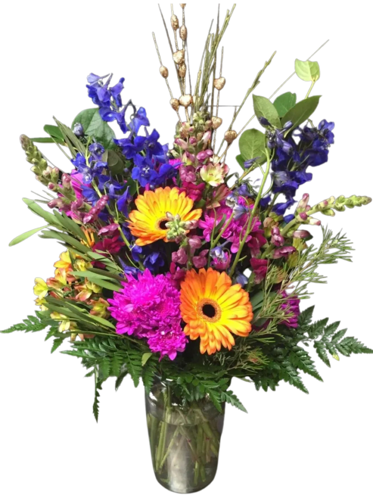 A vase filled with colorful flowers on top of a table.