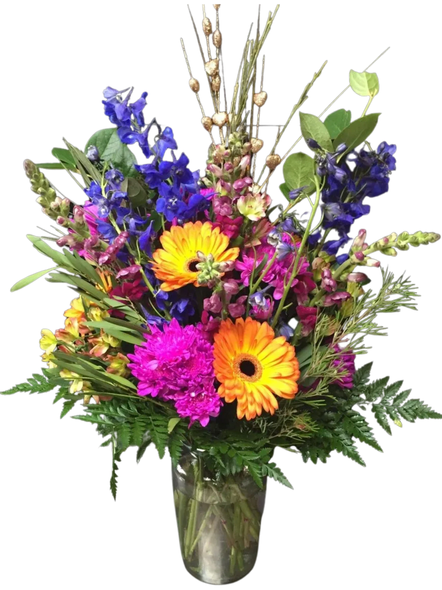 A vase filled with colorful flowers on top of a table.