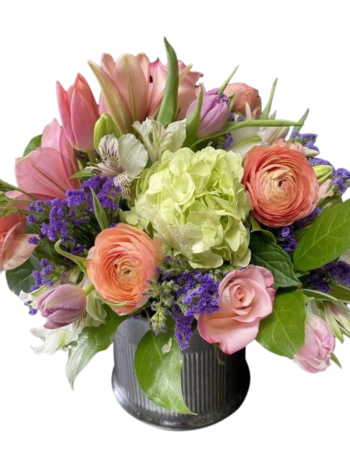 A bouquet of flowers in a vase on a table.