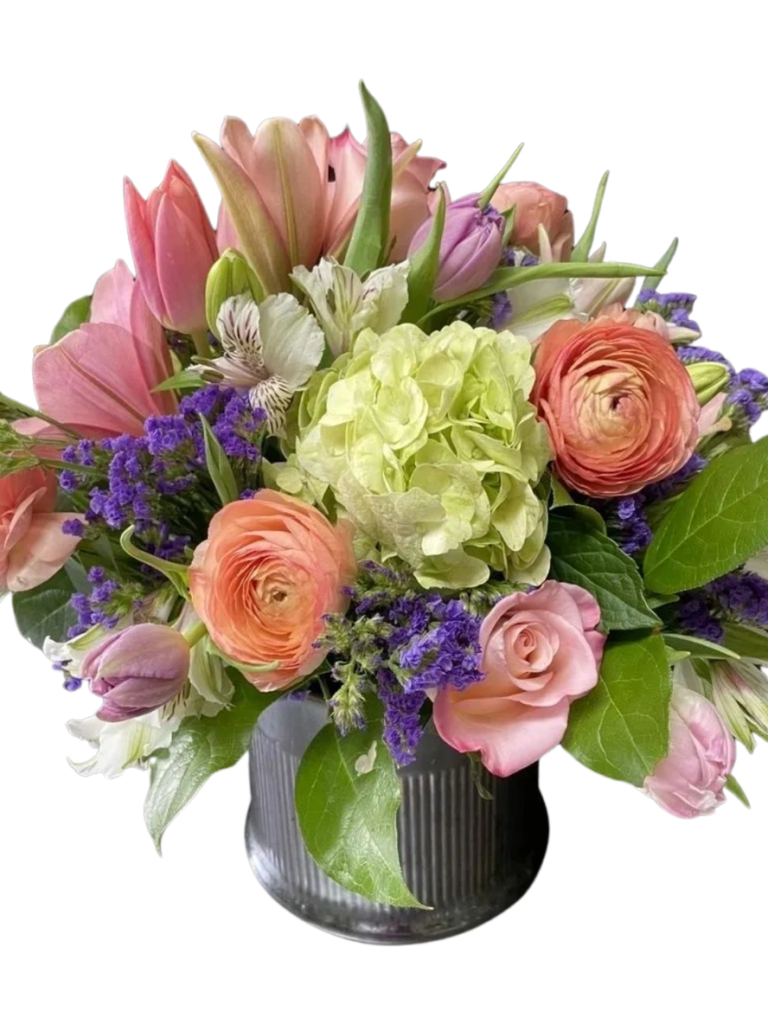 A bouquet of flowers in a vase on a table.