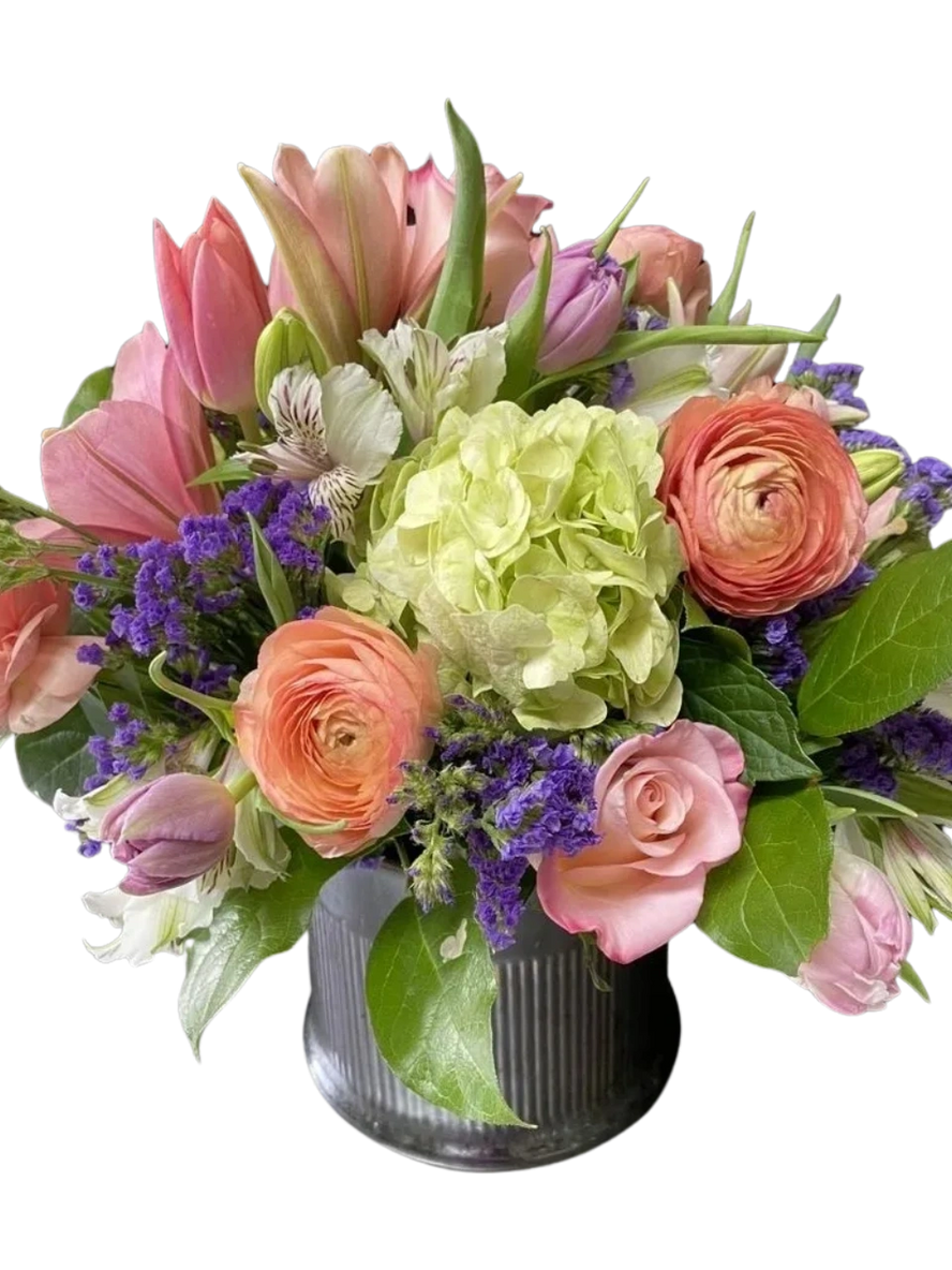 A bouquet of flowers in a vase on a table.