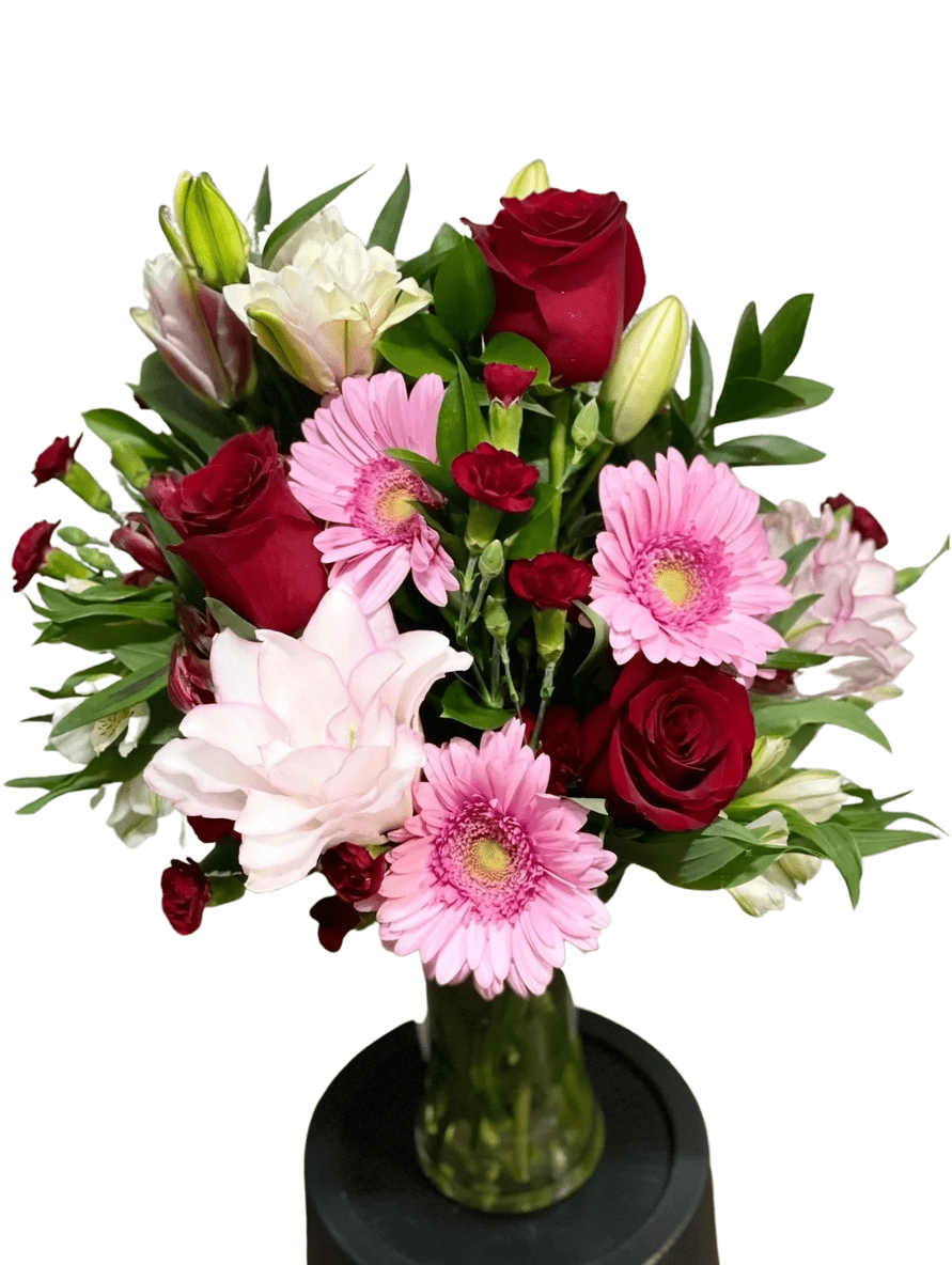 Pink and red flower bouquet in vase.