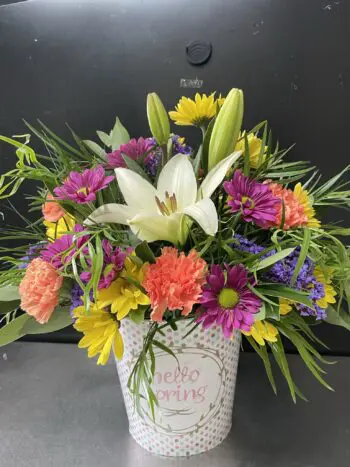 A bouquet of flowers in a vase on the table.