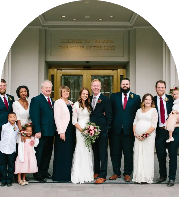 A group of people standing in front of a building.