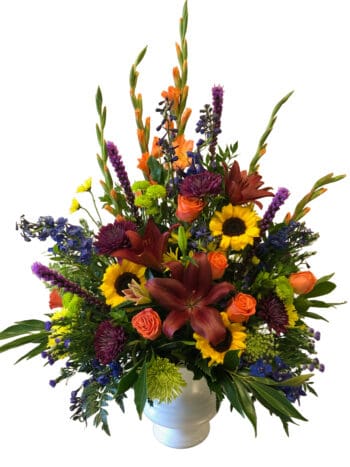 A bouquet of flowers in a vase on a table.