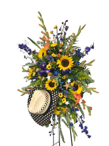 A bouquet of flowers with sunflowers and other plants.