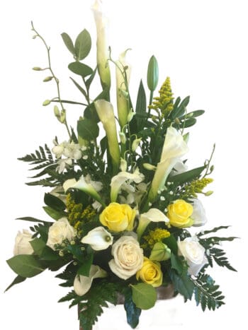 A bouquet of flowers with yellow and white roses.