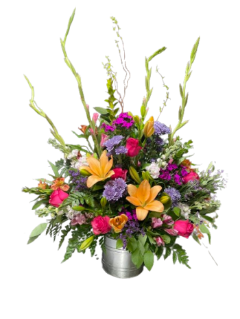 A bouquet of flowers in a metal container.