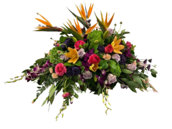 A bouquet of flowers in a vase with a plaid background.