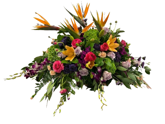 A bouquet of flowers in a vase with a plaid background.