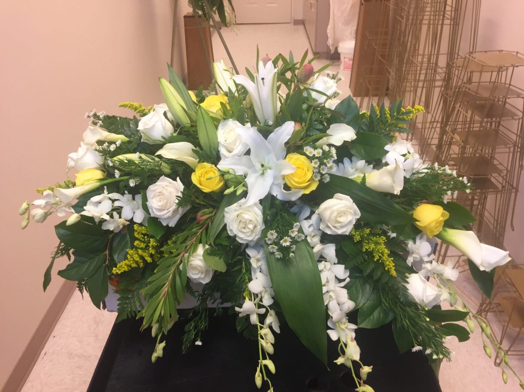 White and yellow flower arrangement.