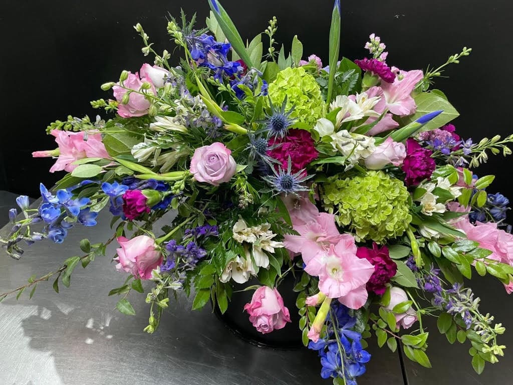 Pink, purple, and blue flower arrangement.